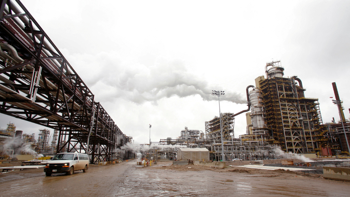 Oil sands upgrading facility with pipelines and processing units in operation